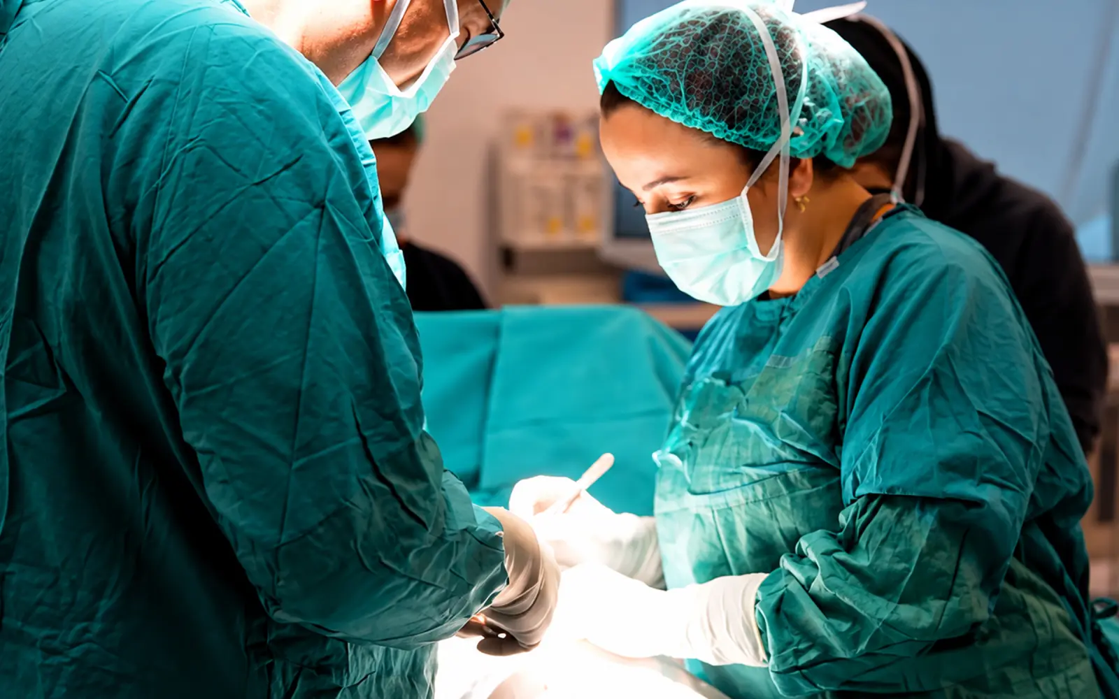 Surgical team performing a procedure in the operating theatre