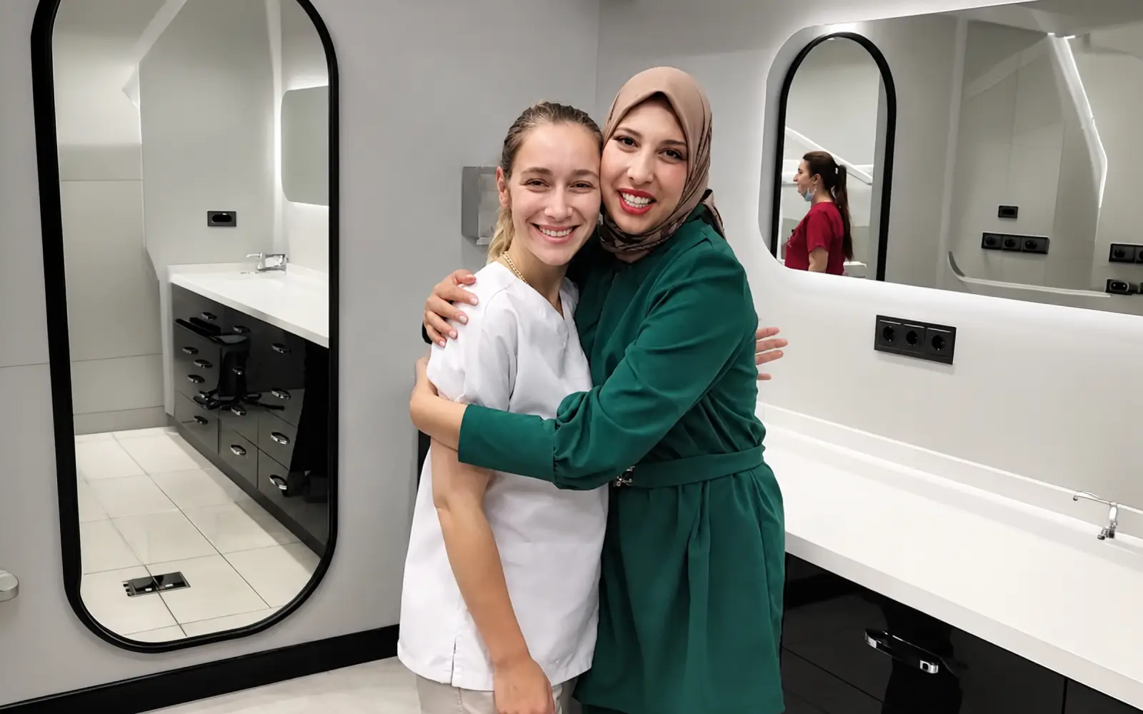 Patient and staff member together after treatment